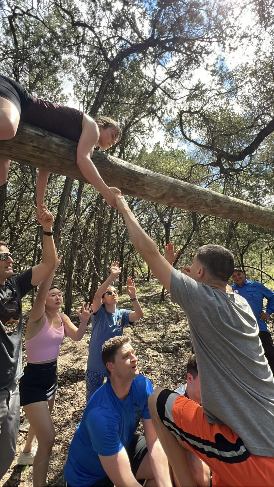 Team on the ropes course in San Antonio practicing Challenge by Choice at Cielo Vista Team Challenge.