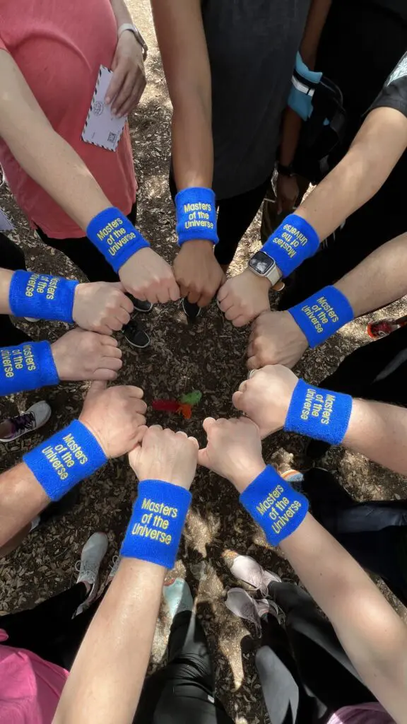 Corporate team celebrating after completing high ropes challenge in San Antonio.